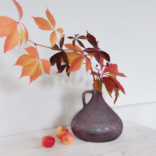 Rustiikkinen pullo maljakko